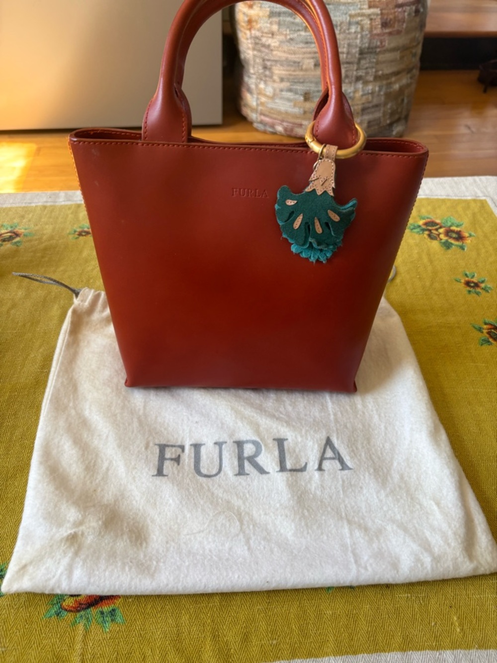 Furla Brick Red Leather Top-Handle Tote with Green Tassel Charm